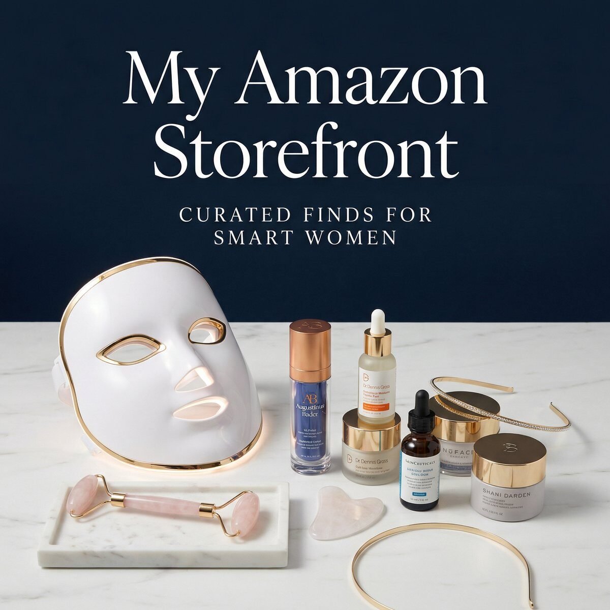 A curated collection of at-home beauty devices and skincare products including an LED face mask, facial roller, serums, and moisturizers on a white marble surface, representing Amy Shorrosh's Amazon storefront for women over 50.